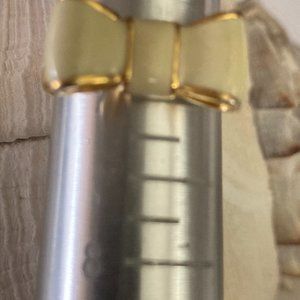 Sweet little Kate Spade off-white and gold bow-tie ring